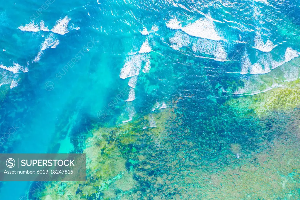 Aerial view to ocean waves. Blue water background. Dramatic colo