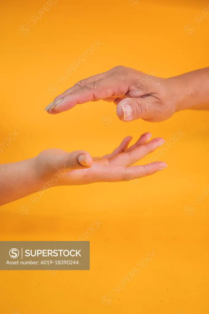 Concept of mother and daughter hands outstretched to get in touch. And share great experiences and learning together.