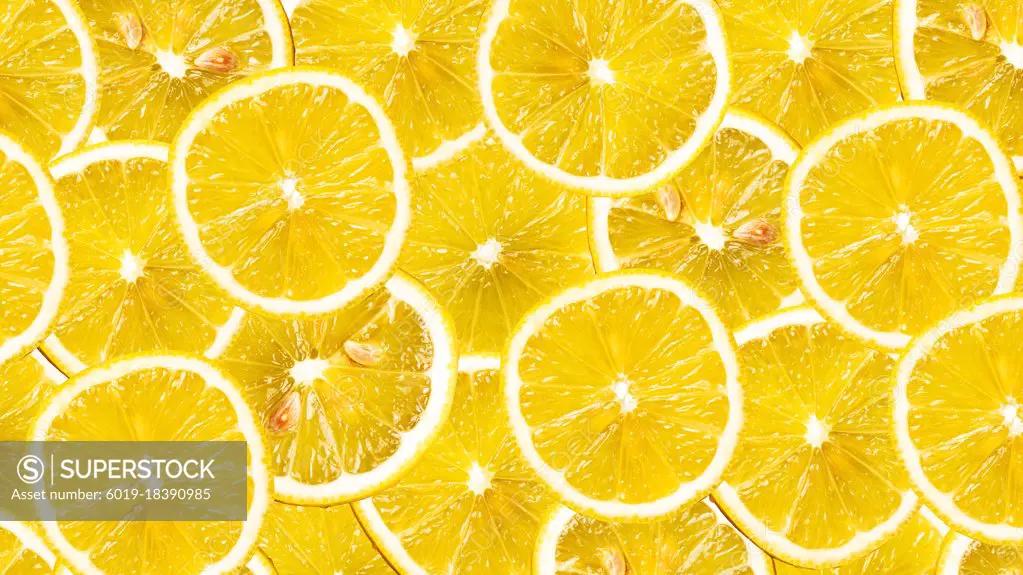 Organic lemon fruit slices natural juicy background.