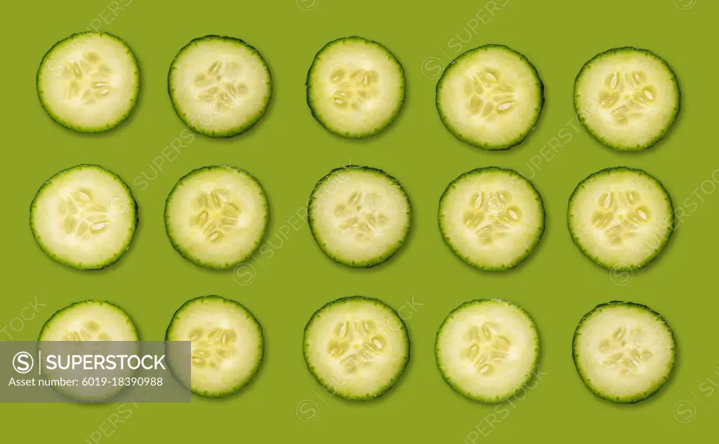 Fresh organic cucumber slices natural juicy pattern background.