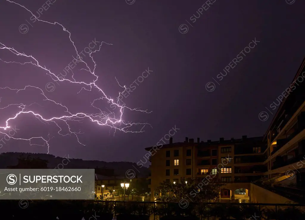 Lightning Storm in the town with city lights