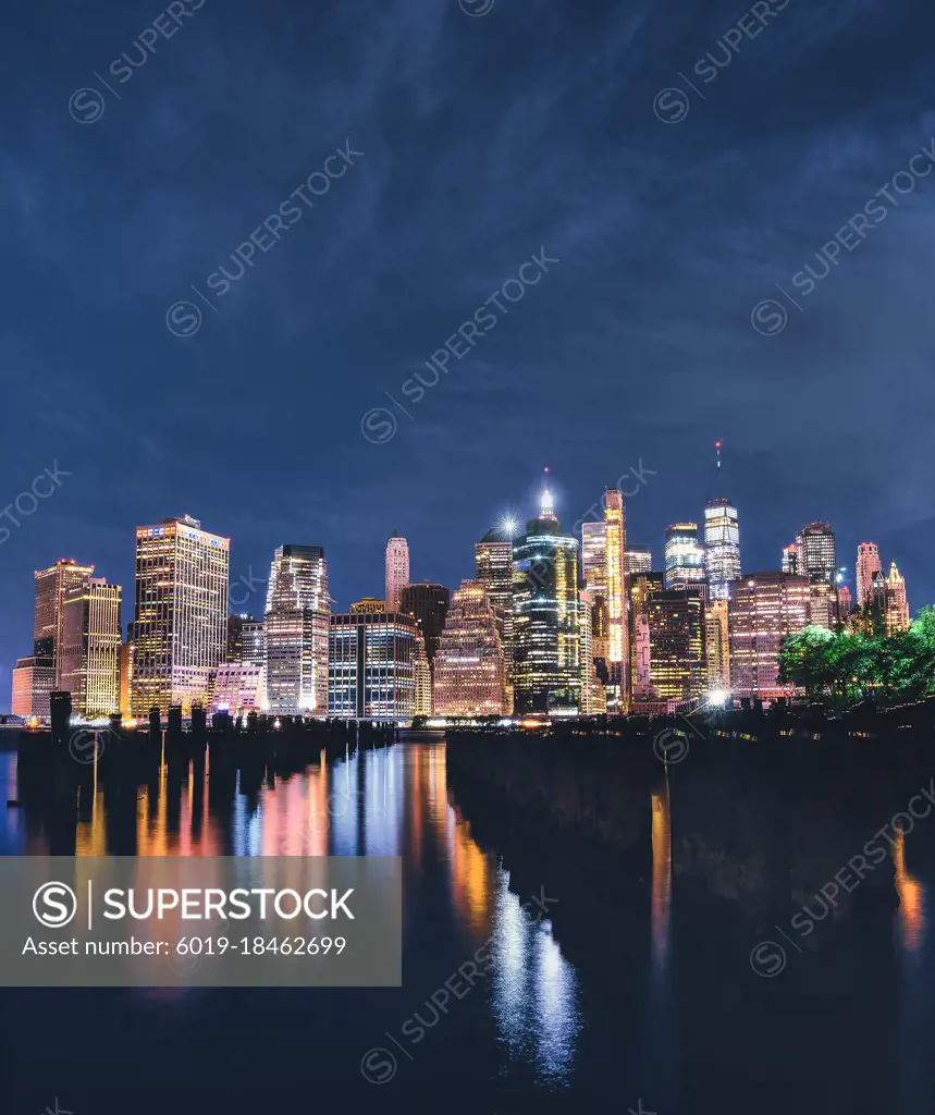 downtown New York City at night beautiful reflections lights colors