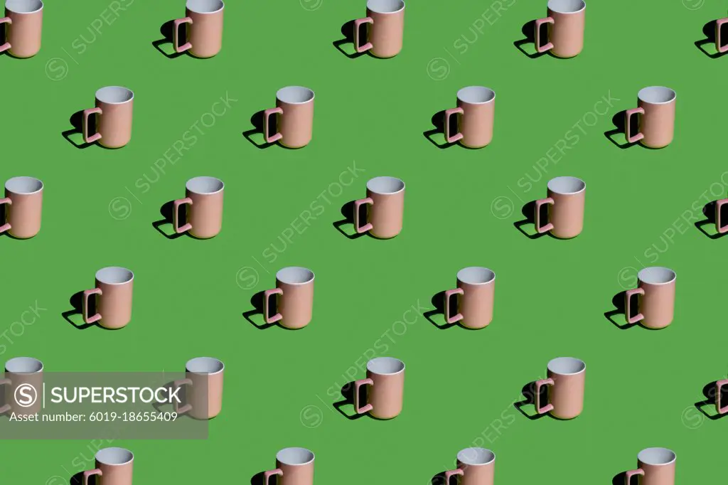 pink mug on a green background