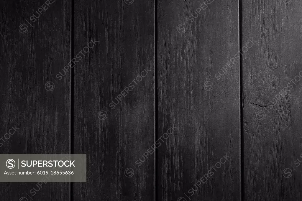 Black wooden table detail. Background or texture