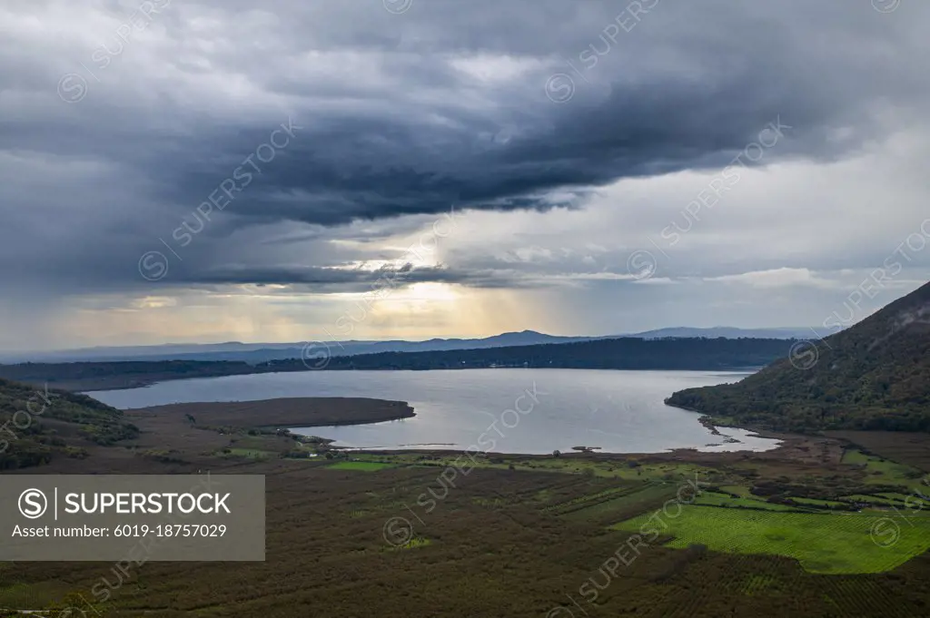 landscape of lake vico seen from a paraglider