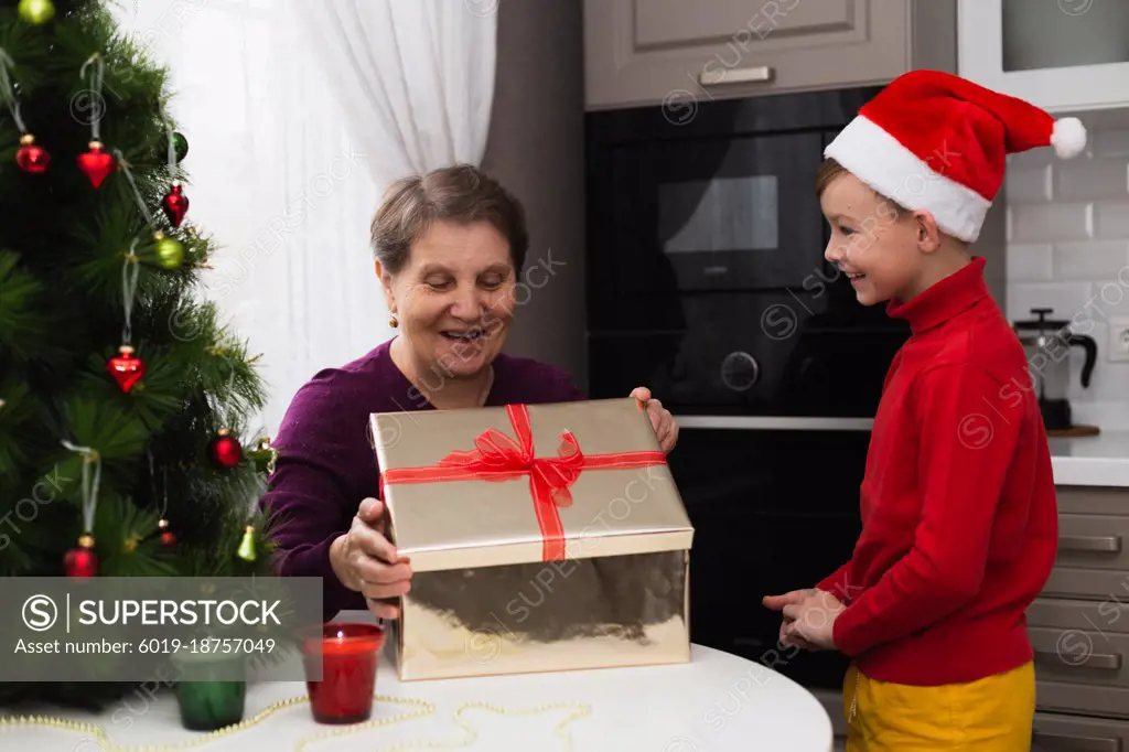 Grandma gets a christmas giving from grandson