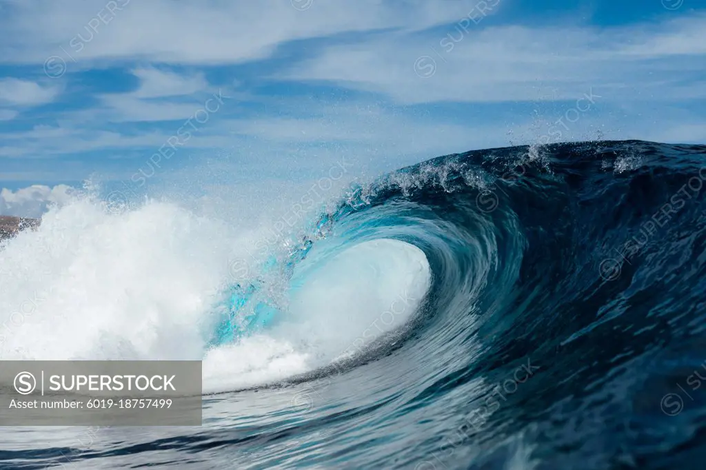 Blue wave breaking on a surfing beach in Canary Islands