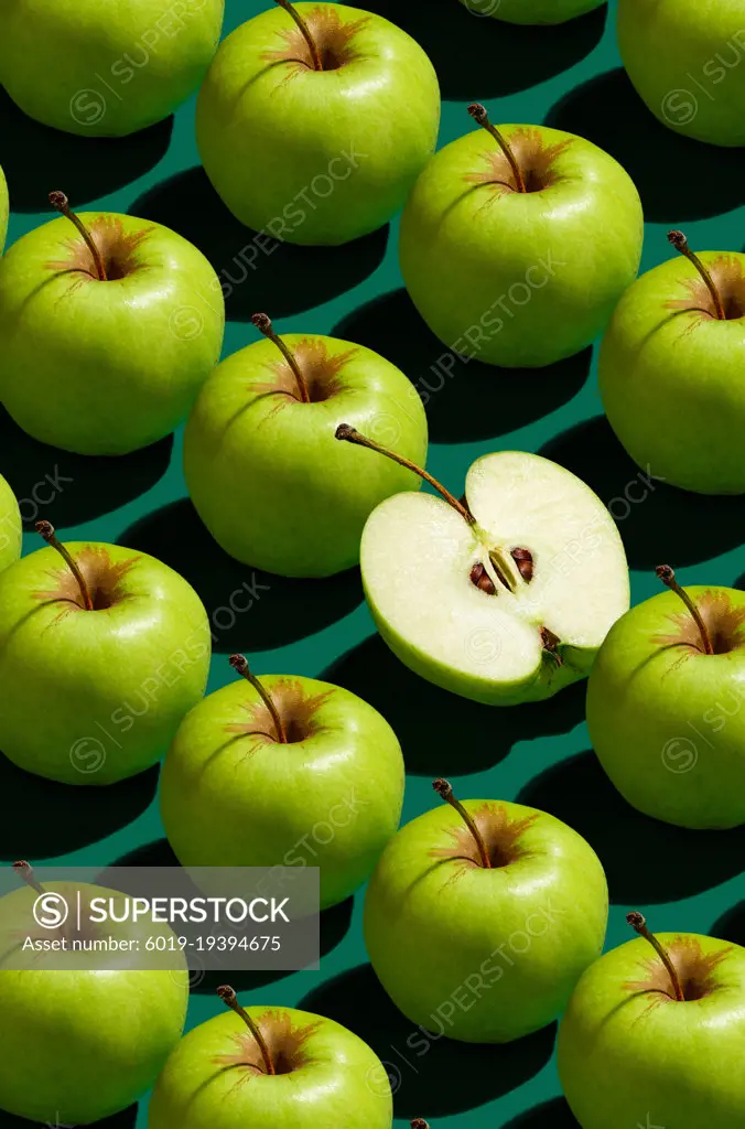 Pattern of green apples on a solid green background