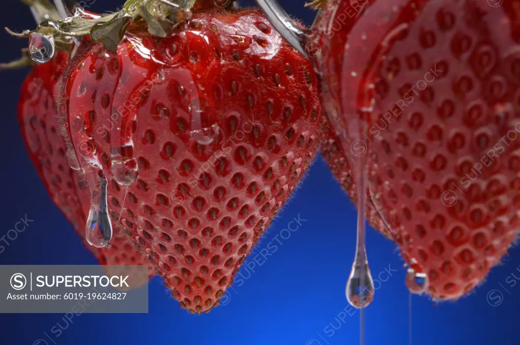 Strawberries dripping with sugary syrup