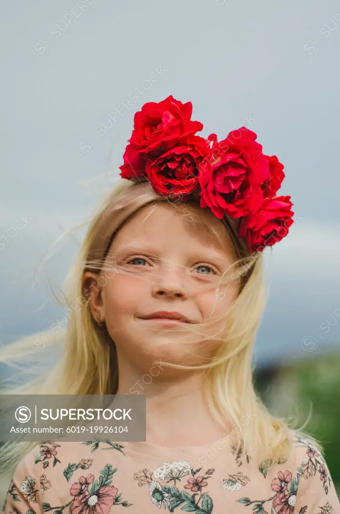 bright girl with a wreath of roses