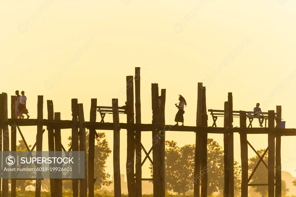 Sunrise walk across U Bein Bridge Myanmar