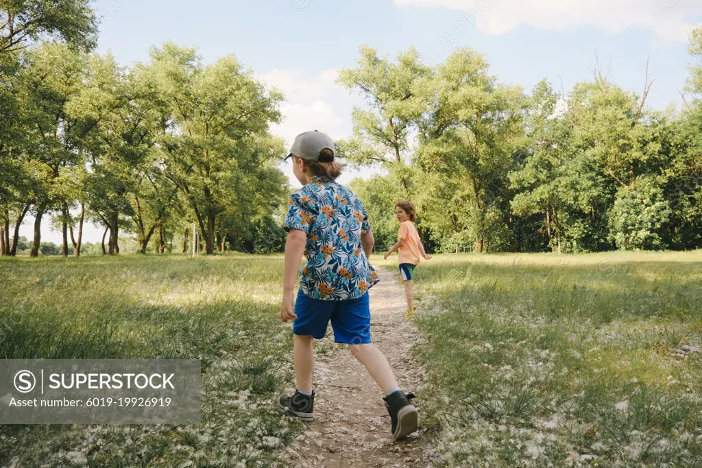 Kids playing outdoors, sport summer day activity