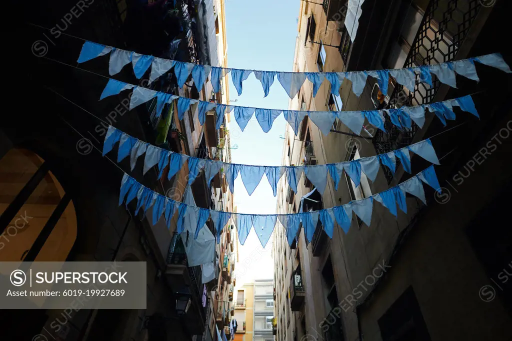 Blue garlands spanned across a street