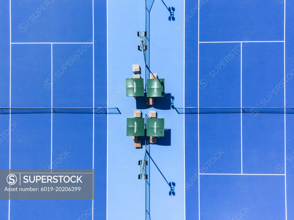 Beautiful top down view to blue hard tennis court with white lines ...