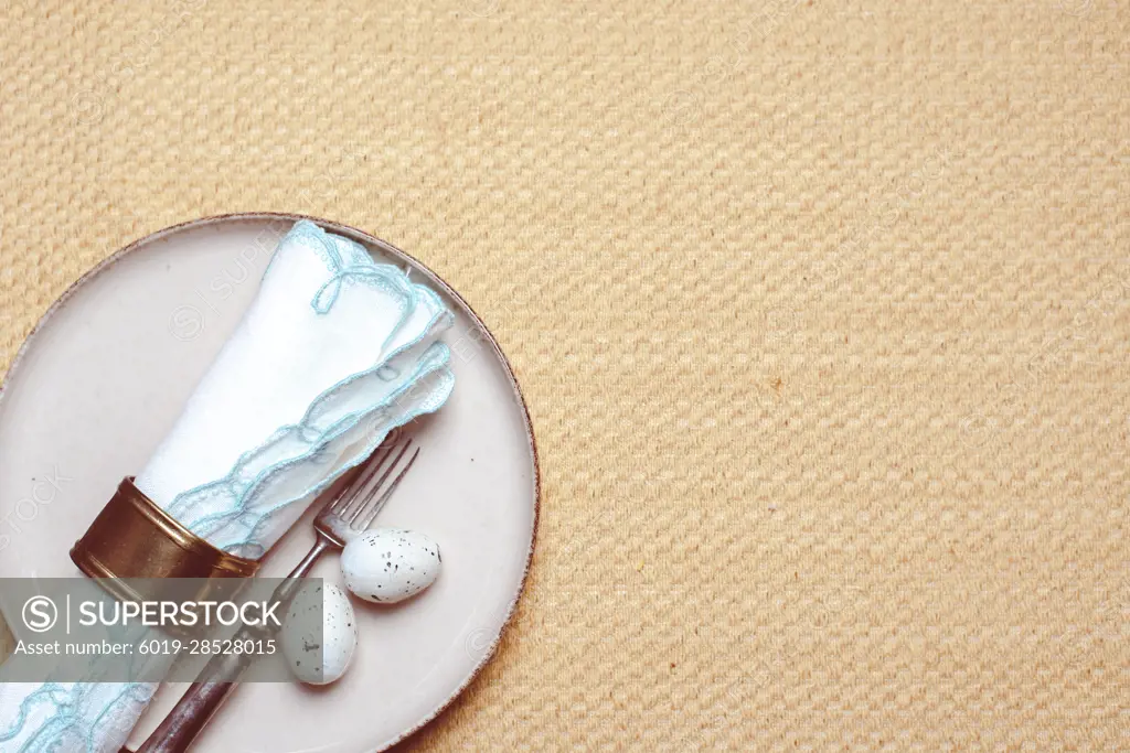 Set table decor with two Easter eggs for a traditional Easter dinner.