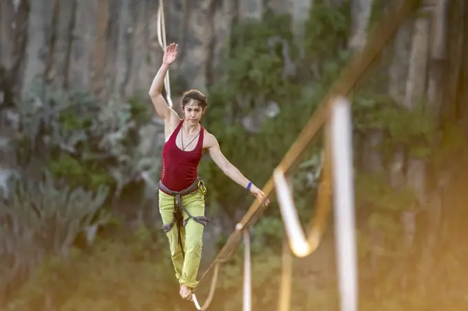 One girl balancing on a highline at "El Gato" canyon near huasca