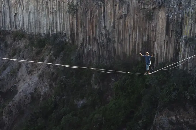 One person walking on a highline at "El Gato" canyon in Meztitlan