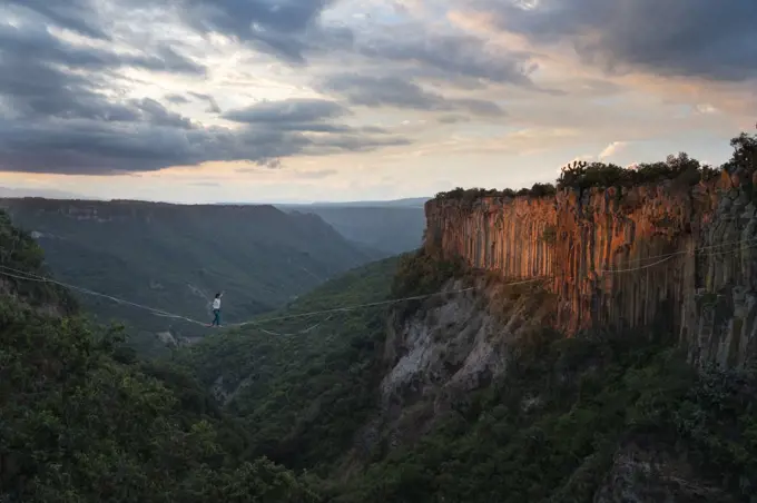 One person balancing on a highline at "El Gato" canyon in the area of Aguacatitla in Huasca de Ocampo, Hidalgo, Mexico.