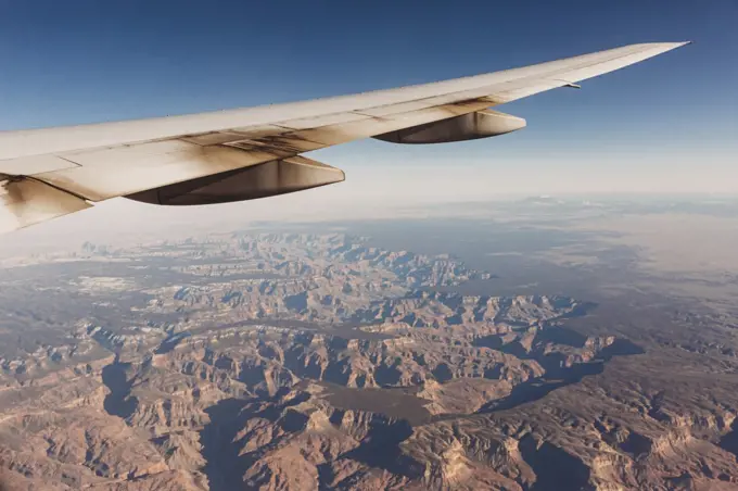 Airplane wing over landscape view of Grand Canyon Arizona