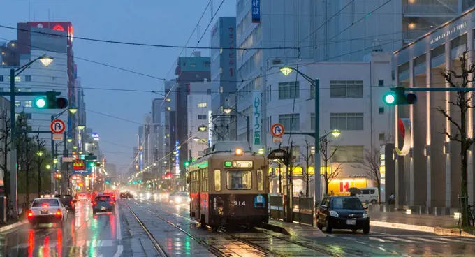 Hiroshima streets with car traffic and tram on the foreground