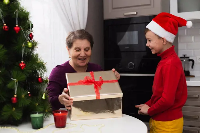 Grandma gets a christmas giving from grandson