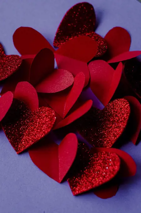 red hearts with sparkles on veri peri background