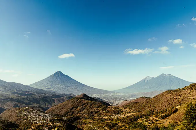 view of the valley with the volcanoes in the background