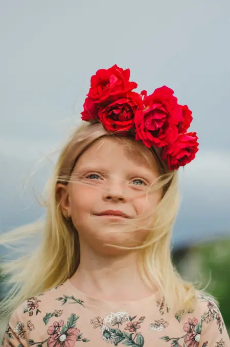 bright girl with a wreath of roses