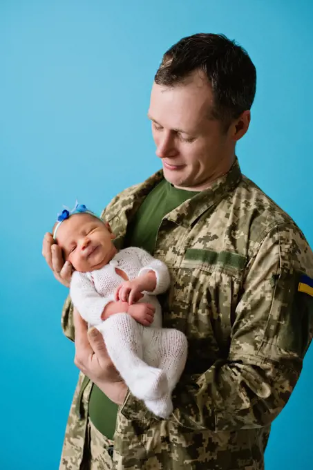Ukrainian military dad with a child girl