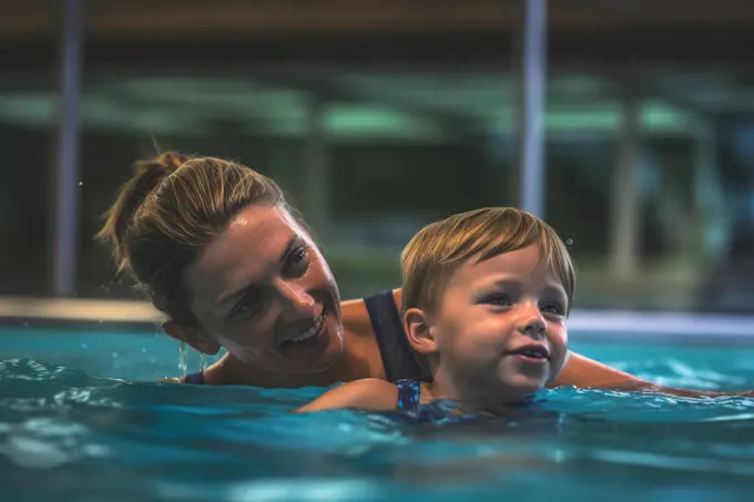 Mom teaching little son how to swim. Generative AI