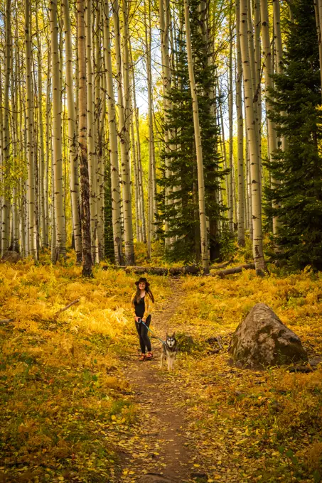 Woman Walking Dog in the Fall Colors of Colorado