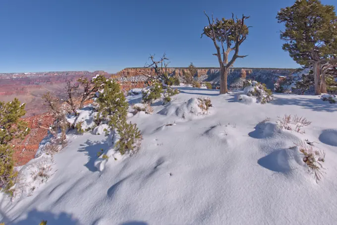 Snowy cliffs of Pipe Creek Canyon at Grand Canyon Arizona