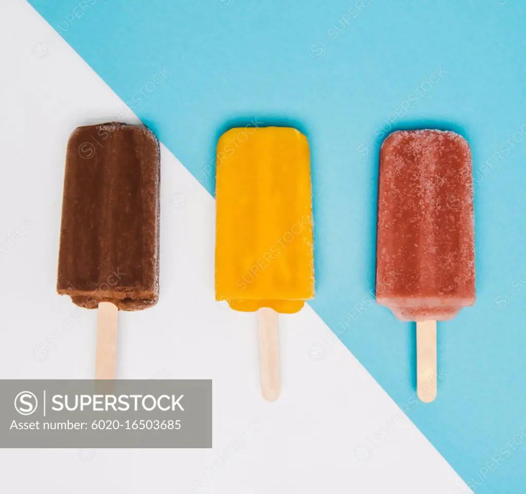 Chocolate, mango, and raspberry popsicles