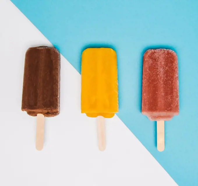 Chocolate, mango, and raspberry popsicles