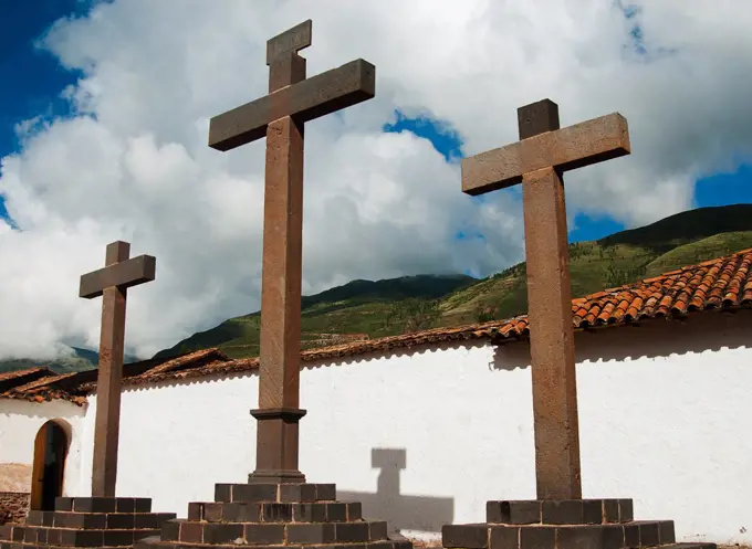 Three crosses outside of an old church, Peru, South America