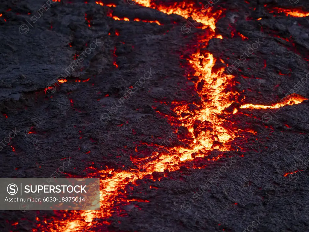 Cracks in lava flow and glowing magma, Fagradalsfjall Volcano, Iceland