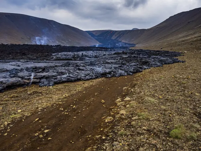 Road being covered by fresh lava from Fagradalsfjall Volcano, Iceland