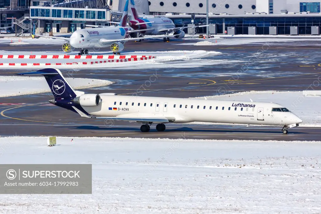 Stuttgart, Germany - February 11, 2021: Lufthansa CityLine Bombardier CRJ-900 airplane at Stuttgart Airport (STR) in Germany.