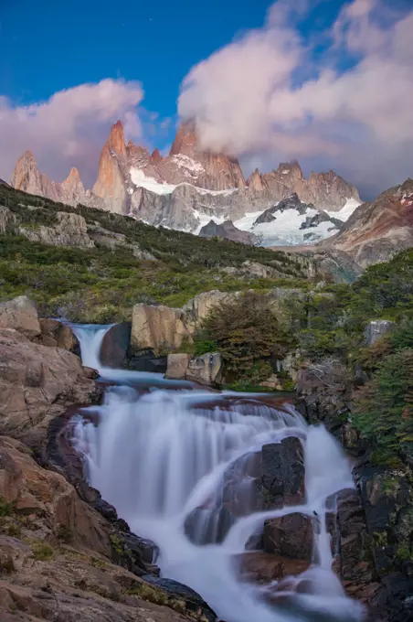 Waterfall with Mt. Fitz roy in the background, Los Glaciares National Park, El Chaltén, Patagonia, Argentina.