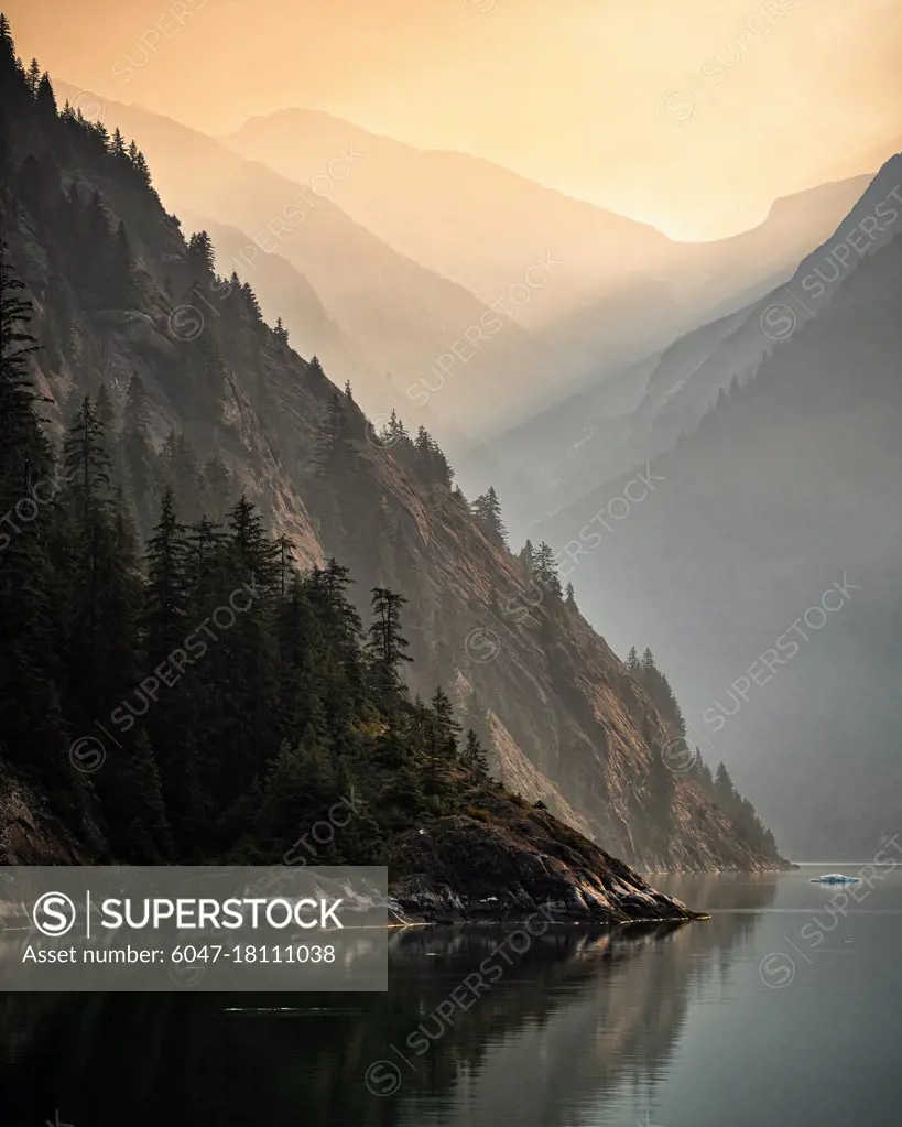 The sun rise is enhanced by smoke from fires in interior Alaska as we sail into Tracy Arm.