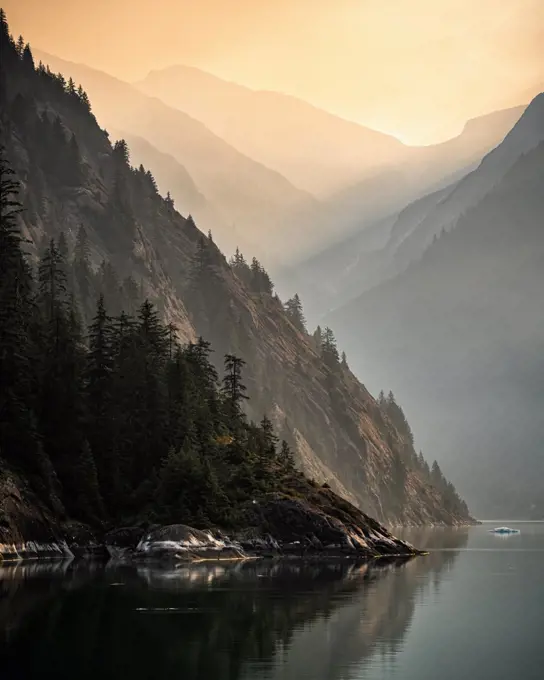 The sun rise is enhanced by smoke from fires in interior Alaska as we sail into Tracy Arm.