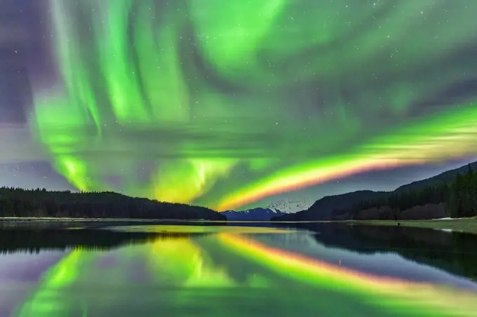 The northern lights dance in the Alaska winter sky.