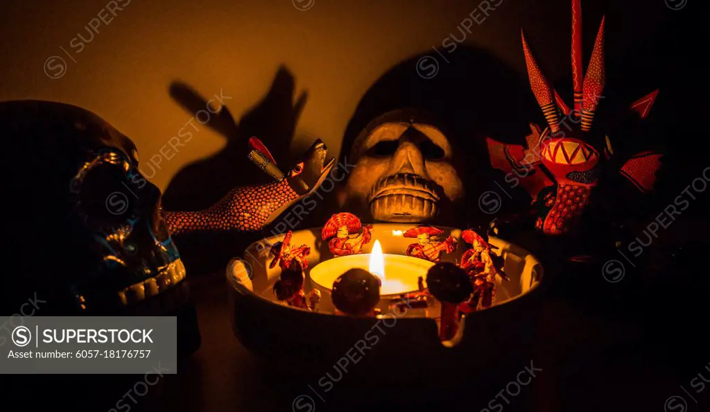 scary shaman ritual figures around a candle at night mariachi