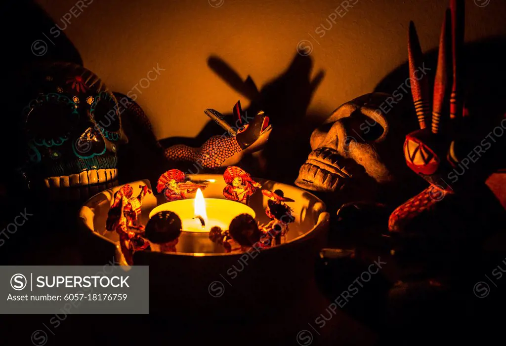 scary shaman ritual figures around a candle at night mariachi