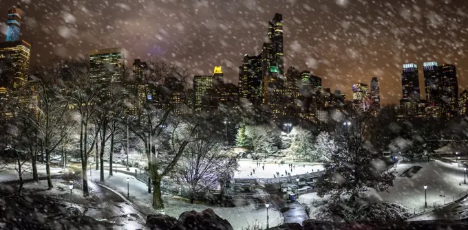 Skating in New York at night during snow