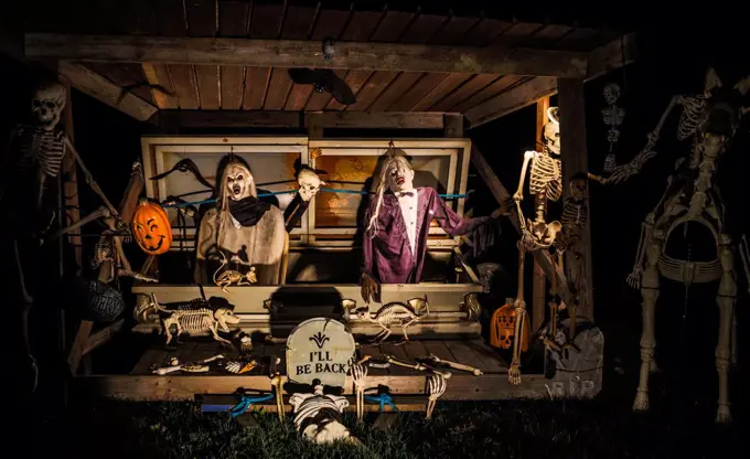 Halloween decorations outside at night setup