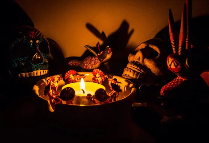 scary shaman ritual figures around a candle at night mariachi