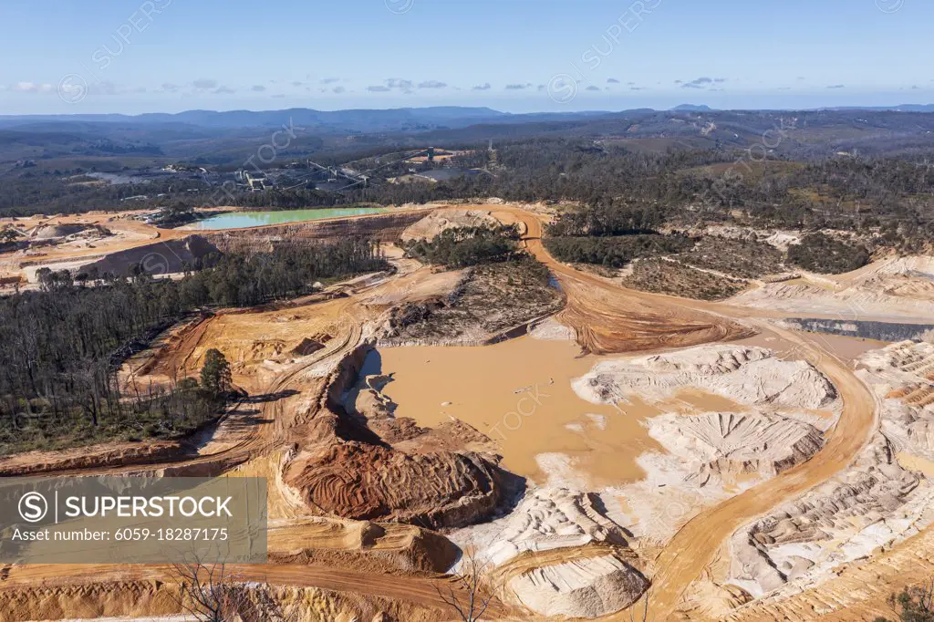 Drone aerial photograph of an industrial Colliery and water reservoirs in a large forest