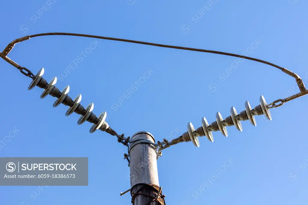 Photograph of a transmission line cable system connected to an assembly bracket