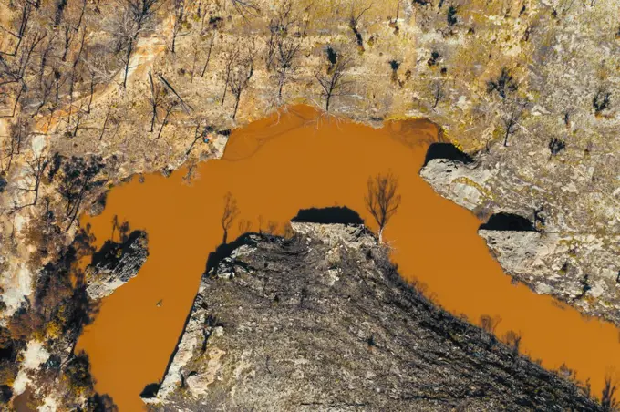 Aerial view of a water reservoir surrounded by forest regeneration after bushfires in Dargan in the Central Tablelands in regional New South Wales Australia